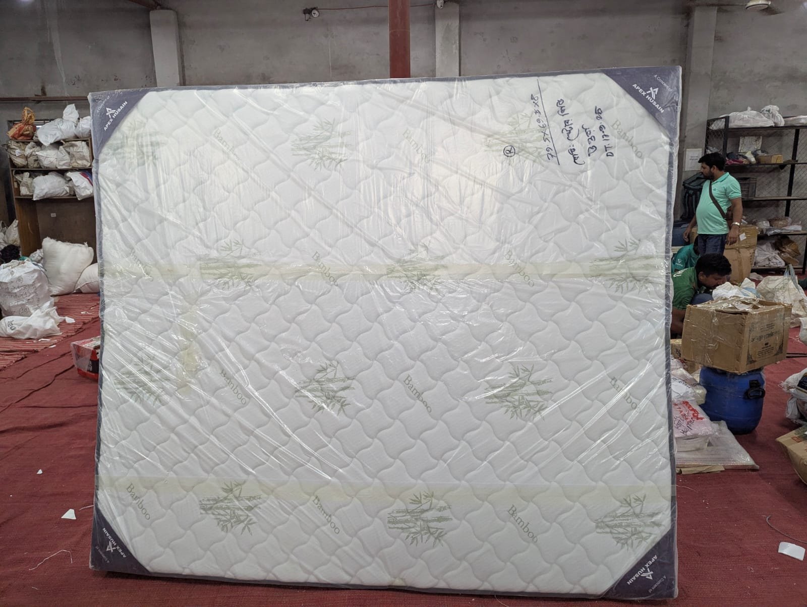 : "Natural bamboo fabric cover on hybrid spring mattress for hypoallergenic and cooling sleep"