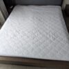 Premium cotton fabric layer in fitted mattress protector