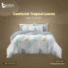 Comforter Tropical leaves print with stylish quilting patterns spread on bed