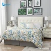 Comforter Botanical Print with elegant floral and leaf patterns on luxurious bed